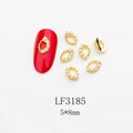 Detail of gold oval nail charm with white pearl LF3185 on a red nail sample - Gold Oval Pearl Style (3185) / 10 Pieces Pack