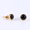 Minimalist gold stud earrings featuring polished round convex black onyx stones - Obsidian