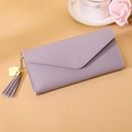 Detail of lavender purple long wallet with gold heart pendant and metal tassel on envelope flap - Long Style / Light Purple