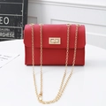 Red PU leather mini crossbody bag with golden chain strap and swivel lock closure - Red