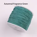DIY jewelry braided cord in autumn green color wound on a white plastic spool - Autumn Green