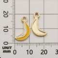 DIY yellow enamel banana pendant for jewelry making with gold-plated edges on grid paper - Yellow Banana