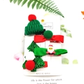 Christmas children's hair clip set with green hat, red bow, Santa, and glittery tree - 4-Piece Green Hat Set