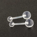 Macro view of two clear acrylic barbell body piercings in different lengths - Belly Ring (Single)