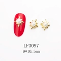 Macro view of sunburst gold metal nail charms with white pearl inlay and size details - 3097 Aurora Pink Pearl Gold Base Starburst (LF3097)