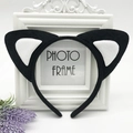 Detail view of black and white plush cat ear headband on vintage photo frame with lavender - Black with White Cat Ears