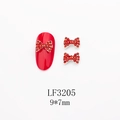 Détail des breloques nœuds rouges en strass 9x7mm LF3205 pour décoration d'ongles - Nœud Doré avec Strass Rouge au Centre (LF3205)