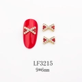 Détail du bijou d'ongle nœud 9x6mm avec strass rouges et blancs sur base en alliage doré - Nœud Doré Mixte Strass Rouges/Blancs (LF3215)