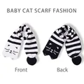 Knitted baby cat scarf with black and white jacquard pattern and plush pompoms - Kids Double-Sided Cat Scarf