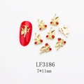 Detailed macro view of cherry nail art charms with red rhinestones and gold alloy metal - Red Cherry Rhinestone Style (3186) / 10 Pieces Pack