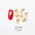 Detail of 7x11mm golden butterfly nail charm with colorful rhinestones on red nails - Gold Rhinestone Leaf Style (3187) / 10 Pieces Pack