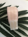 Roze dispenser voor ooglidtape met natuurlijke mesh-stickers op een groen blad - Roze Hart Case L-Type (Rond)