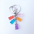 Macro view of colorful gummy bear pendants on metal keyrings with lobster clasps - Colorful 2
