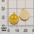 Yellow enamel smiley face charms for DIY jewelry making shown on a measurement scale - Yellow Smiley Face Pendant (10976)