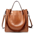 Retro brown oil wax leather bucket bag with circular handle and adjustable strap - Brown