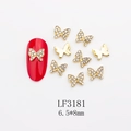 Macro view of 6.5x8mm gold butterfly nail charms with rhinestones and pearl details - Gold Full Rhinestone Butterfly Style (3181) / 10 Pieces Pack