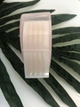 Lace mesh double eyelid tape roll in pink dispenser on green leaf background - Pink Heart Case (Olive Shape)