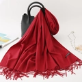 Solid vibrant red cashmere scarf with elegant tassels draped over a black leather handbag - 200*70cm / Wine Red