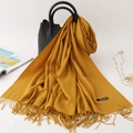 Ginger yellow cashmere-feel scarf with tassels styled on a leather handbag - 200*70cm / Turmeric