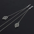 Silver metal eyewear chain with hollow leaf charms and non-slip silicone loops - Silver