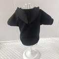 Detail of black pet hoodie with pocket and hood on model for small dogs and cats - Black