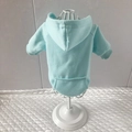Detail of light blue pet hoodie featuring a functional back pocket and ribbed hem - Light Blue