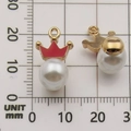 Red enamel crown pendant with pearl in golden finish shown on a metric measurement scale - Red Triangle Pattern
