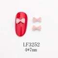 Détails du nœud en perle rose 4x7mm pour nail art sur un ongle rouge brillant - Base Dorée Perle Rose (LF3252)