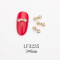 Détail de bijoux d'ongles en forme de nœud doré 3x8mm avec strass AB et métal doré - Base Dorée Strass AB (LF3235)