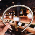 Detail of white pearls on golden metal headband with black protective end tips - 8# Classic Single Row Pearls