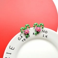 Detail of Christmas candy cane earrings with pink flowers on a green base - Green Candy Cane