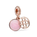 Detail of rose gold charm with pink enamel disc and geometric openwork circular design - Rose Gold Pink Style