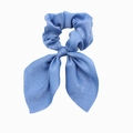 Close-up of blue satin hair scrunchie with long ribbon bow showing silky fabric texture - Sky Blue