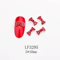Dettaglio di ciondoli per unghie a fiocco rosso con base in lega e strass per manicure - Stile Strass Rosso Brillante Base Argentata (3295)