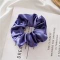 Elegant purple satin crystal scrunchie with soft silk luster on a minimalist background - Purple