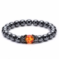 Hematite beaded bracelet with orange accent stone and black zircon crown charms - Hematite