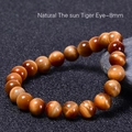 Bracciale di perle occhio di tigre naturale 8mm con effetto occhio di gatto dorato e lucido - Occhio di Tigre Solare Naturale (8mm)