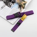 Detail of purple nylon tactical belt with black plastic buckle and yellow label - Deep purple