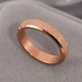 Minimalist rose gold titanium steel ring featuring a matte sandblasted finish and smooth interior - US 4 / Rose Gold