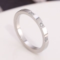 Sleek silver stainless steel ring featuring three small inset diamonds in a row - US 5 / Silver With Three Diamonds