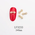 Detailed view of pearl bow nail art charms with dimensions 3x8mm for DIY manicure - Gold Base White Pearl (LF3233) / 3*8mm