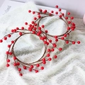 Artificial red berry wreath with glossy berries and brown stems on white fur background - Standard / Red Berry