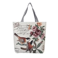 Detail van vintage bloemenborduurwerk en vogelpatronen op een canvas draagtas - Twee Mezen Met Vintage Bloemen En Schrift Stijl