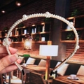 Detailed view of handmade pearl headband with alternating beads on a golden metal ring - 5# Alternating Spaced White Pearls