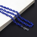 Close-up of blue acrylic glasses chain with silicone anti-slip loops on a book edge - Royal Blue