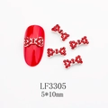 Dettaglio di ciondoli per unghie a fiocco con strass rossi e base in metallo da 5x10mm - Stile Strass Rosso Completo Base Argentata (3305)