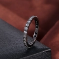Macro shot of eternity ring with white zircons on dark gunmetal plating background - US 9 / Gunmetal Plated with White Zirconia