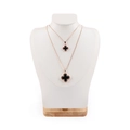 Rose gold necklace set featuring black clover pendants on white ergonomic display stands - Large / White Brushed Leather: Large