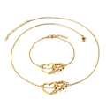 Set collana e bracciale dorati con ciondoli a forma di cuore e zampa con estensione - Set Cuore e Impronta Oro (KS114764-K)