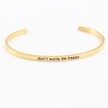 Golden stainless steel cuff bracelet with don't worry be happy engraving - don't worry be happy